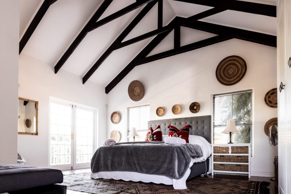Spacious ADU bedroom with vaulted ceilings and wood trusses